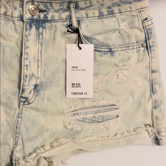 Light Denim Distressed Mid Rise Jean shorts - Picture 4 of 6